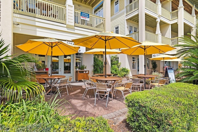 view of patio featuring a balcony