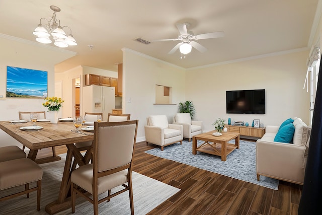 dining area with dark hardwood / wood-style floors and crown molding