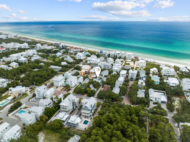 bird's eye view featuring a beach view and a water view