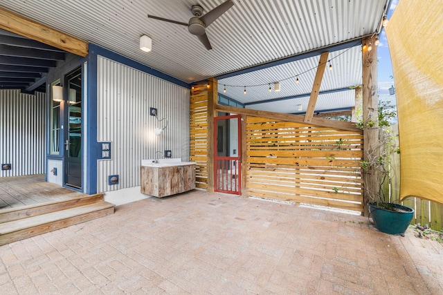 view of patio featuring ceiling fan