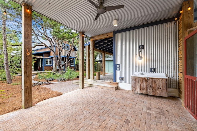 view of patio / terrace featuring ceiling fan