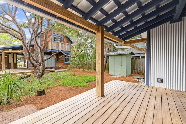 wooden deck with a shed