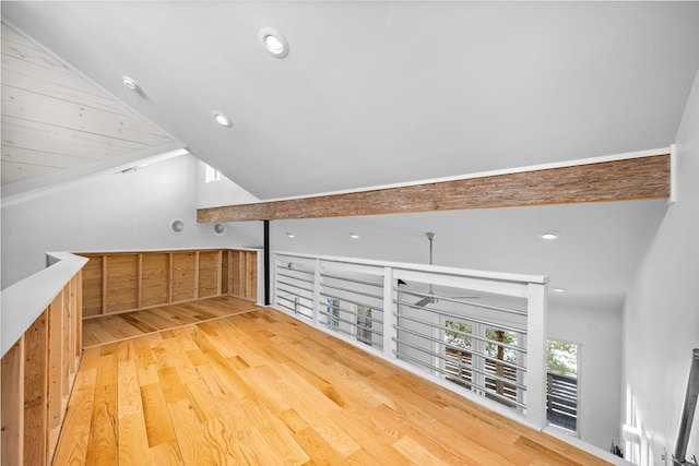 bonus room with vaulted ceiling and light hardwood / wood-style flooring