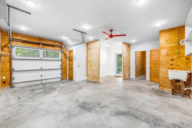 garage with ceiling fan and sink