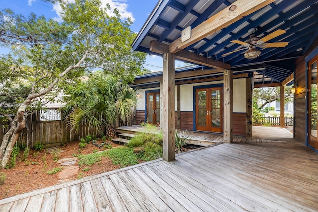 deck with french doors and ceiling fan