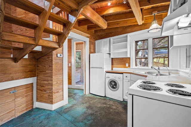 kitchen featuring wooden walls, white appliances, white cabinetry, sink, and washer / dryer