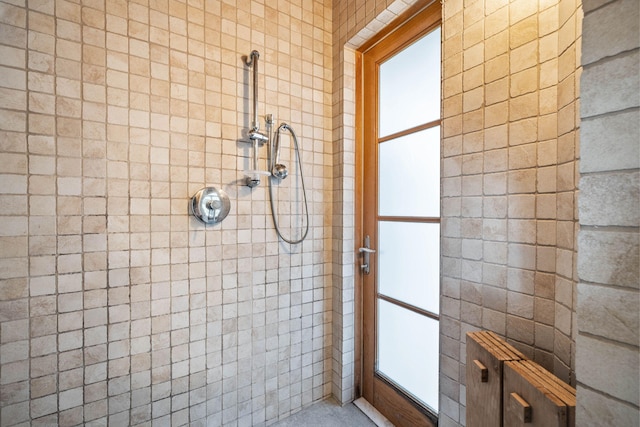 bathroom with tiled shower