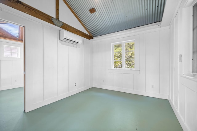 unfurnished room with lofted ceiling, a wall mounted AC, and concrete floors