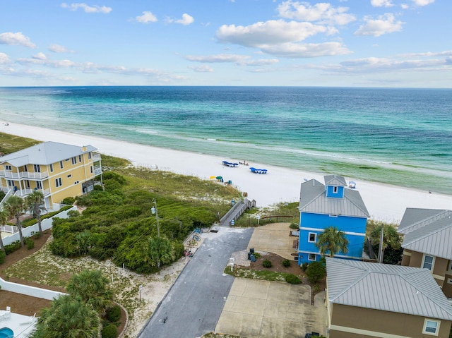 bird's eye view with a water view and a beach view