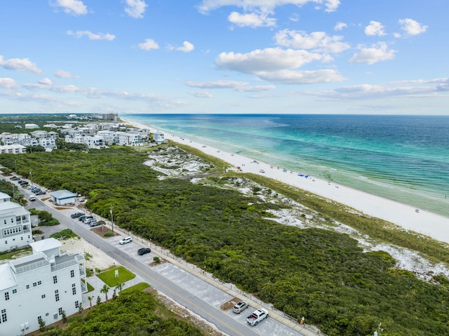 aerial view with a water view and a beach view