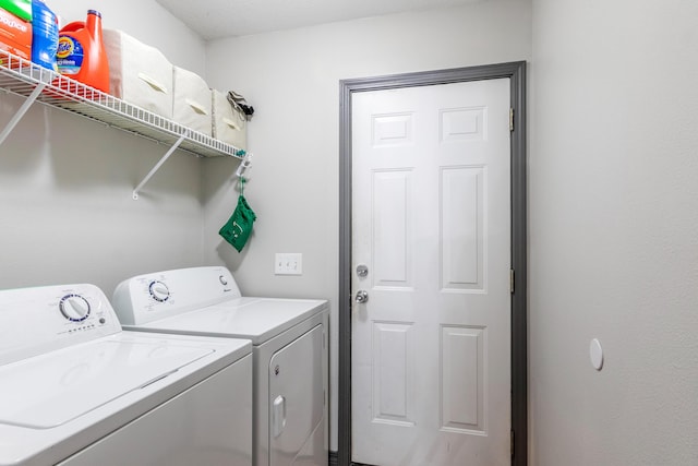 washroom featuring washer and clothes dryer