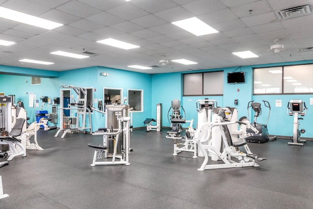 gym featuring a paneled ceiling