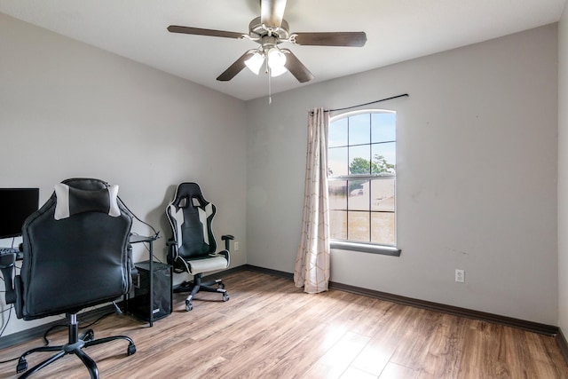 office area with ceiling fan and light hardwood / wood-style floors