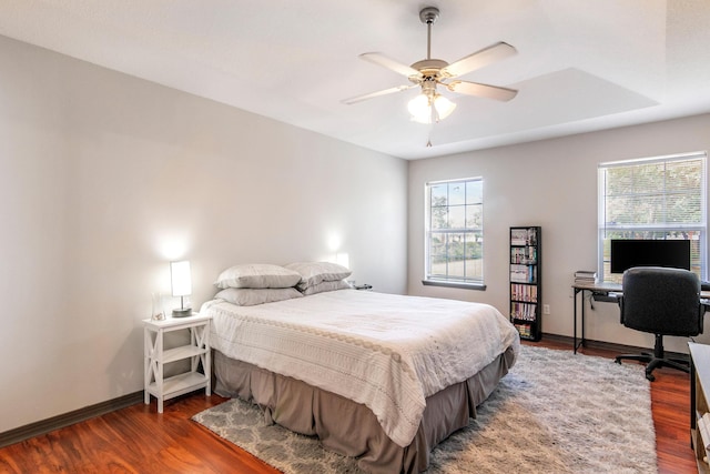 bedroom with hardwood / wood-style floors and ceiling fan