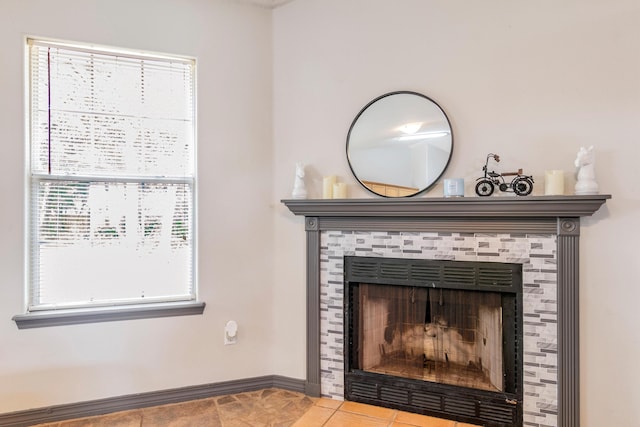 interior details featuring tile patterned floors and a tile fireplace