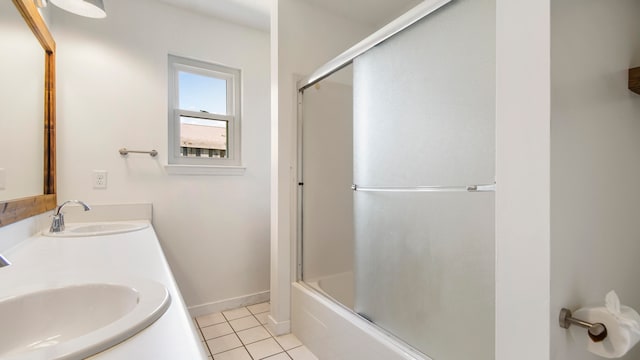 bathroom with vanity, enclosed tub / shower combo, and tile patterned flooring