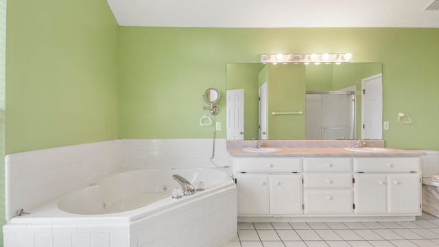 full bathroom with vanity, toilet, shower with separate bathtub, and tile patterned flooring