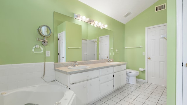 full bathroom with vanity, vaulted ceiling, toilet, tile patterned floors, and independent shower and bath