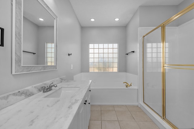 bathroom with vanity, independent shower and bath, and tile patterned floors