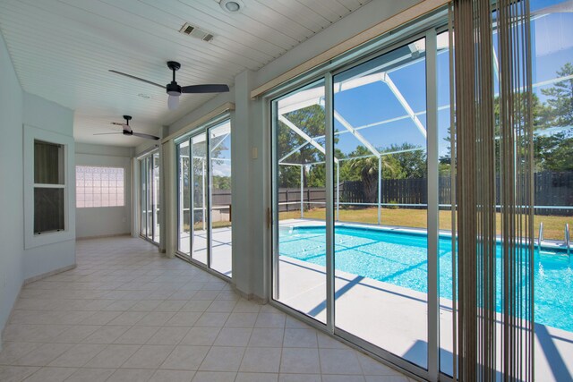 view of swimming pool featuring ceiling fan