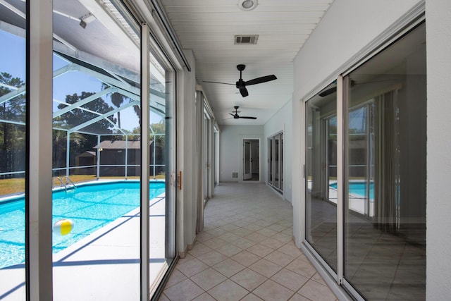 view of swimming pool featuring ceiling fan