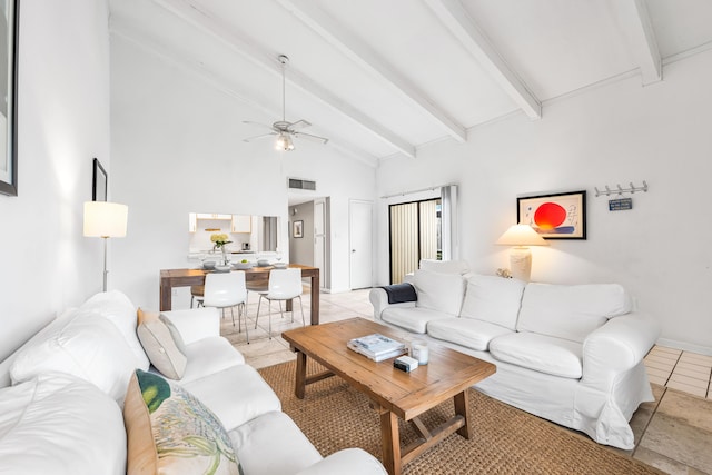 tiled living room with ceiling fan and lofted ceiling with beams