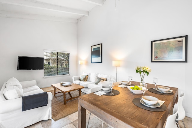 living room featuring lofted ceiling with beams