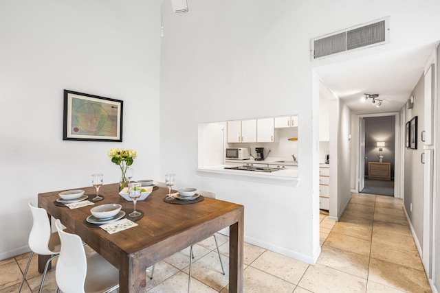 dining space with light tile patterned floors