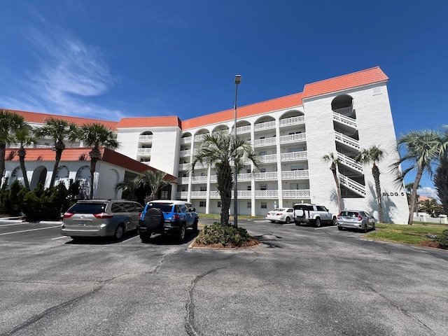 view of property with uncovered parking