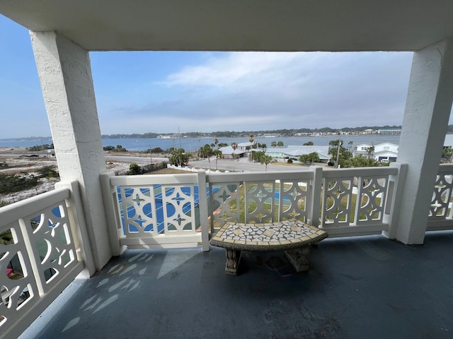 balcony featuring a water view