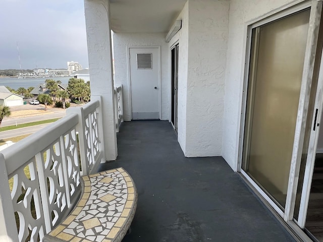 balcony featuring a water view