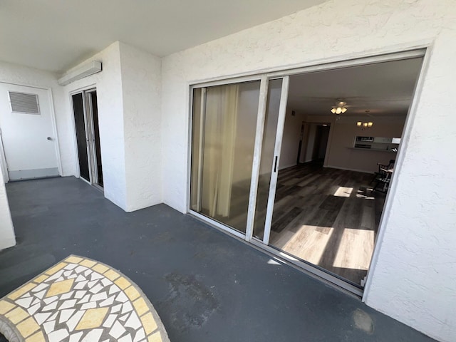 exterior space with visible vents and stucco siding