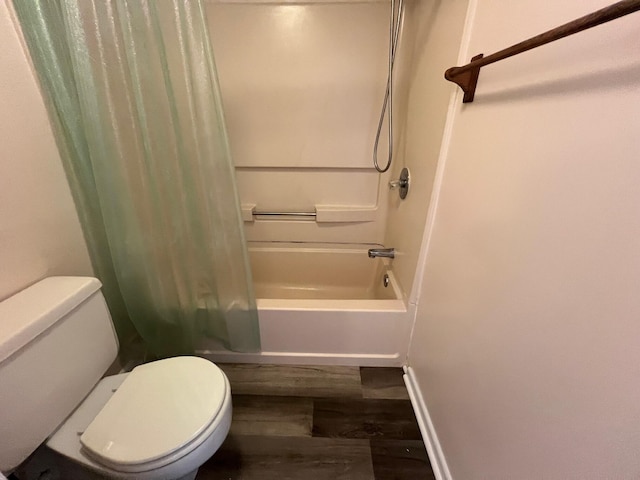 full bathroom featuring shower / bathtub combination with curtain, toilet, and wood finished floors