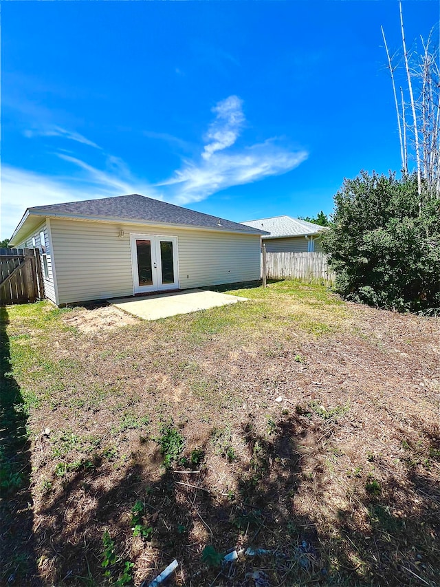 rear view of property with a patio and french doors