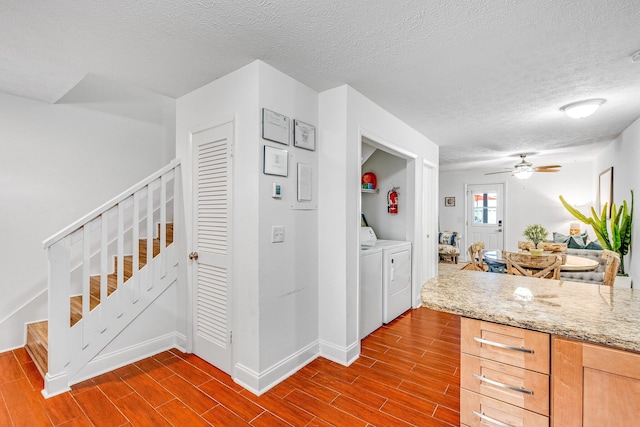 kitchen with a textured ceiling, hardwood / wood-style flooring, and ceiling fan