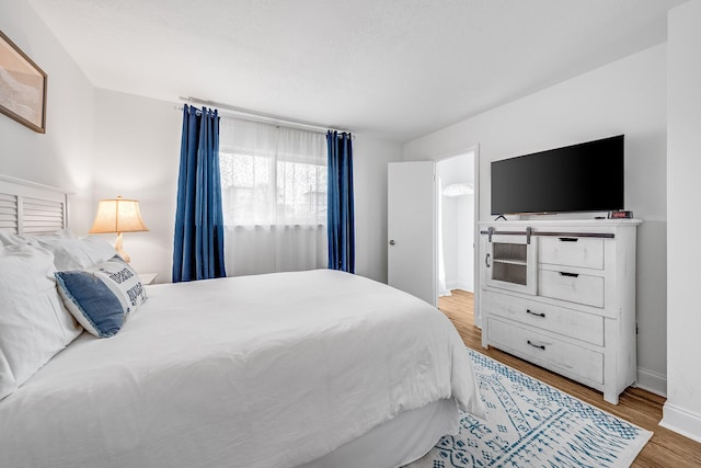 bedroom featuring hardwood / wood-style flooring