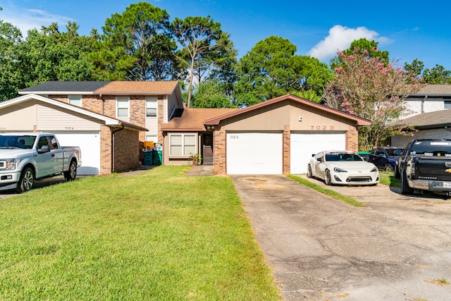 view of front property featuring a garage and a front yard