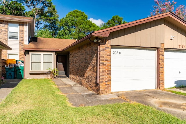 view of front of house with a front lawn and a garage