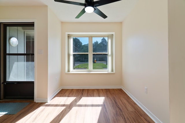 spare room featuring ceiling fan and hardwood / wood-style floors