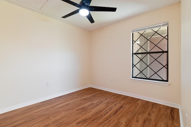 unfurnished room featuring ceiling fan and wood-type flooring