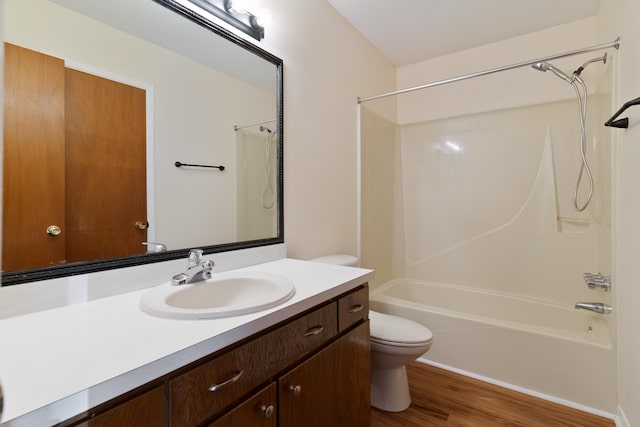 full bathroom with toilet, vanity, a textured ceiling, shower / tub combination, and hardwood / wood-style flooring