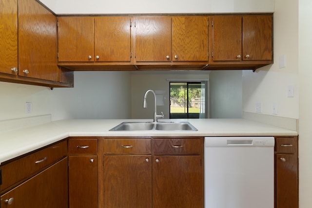 kitchen with white dishwasher and sink