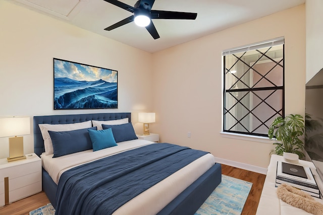 bedroom featuring ceiling fan and hardwood / wood-style floors