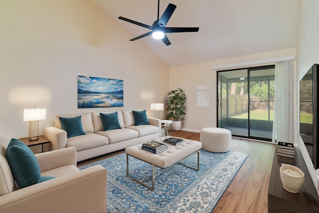 living room with wood-type flooring, ceiling fan, and high vaulted ceiling