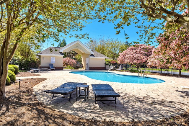 view of swimming pool featuring a patio