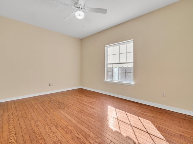 unfurnished room with ceiling fan and light hardwood / wood-style flooring