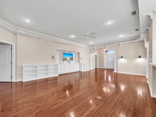 unfurnished living room featuring ceiling fan and hardwood / wood-style flooring