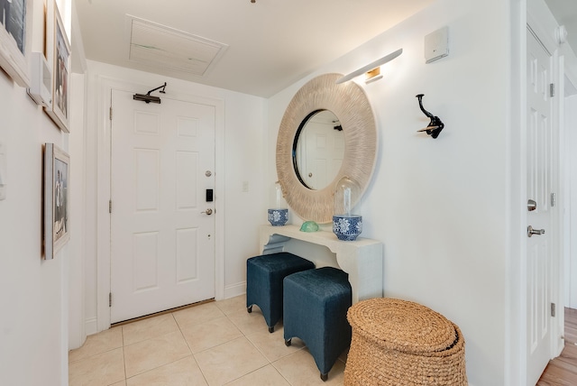 foyer with light tile patterned floors