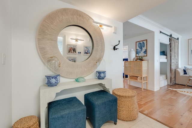 bathroom with hardwood / wood-style flooring and ornamental molding