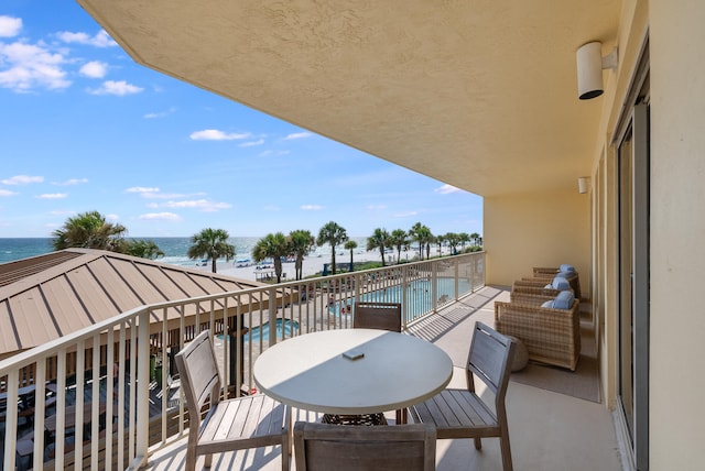 balcony featuring a water view